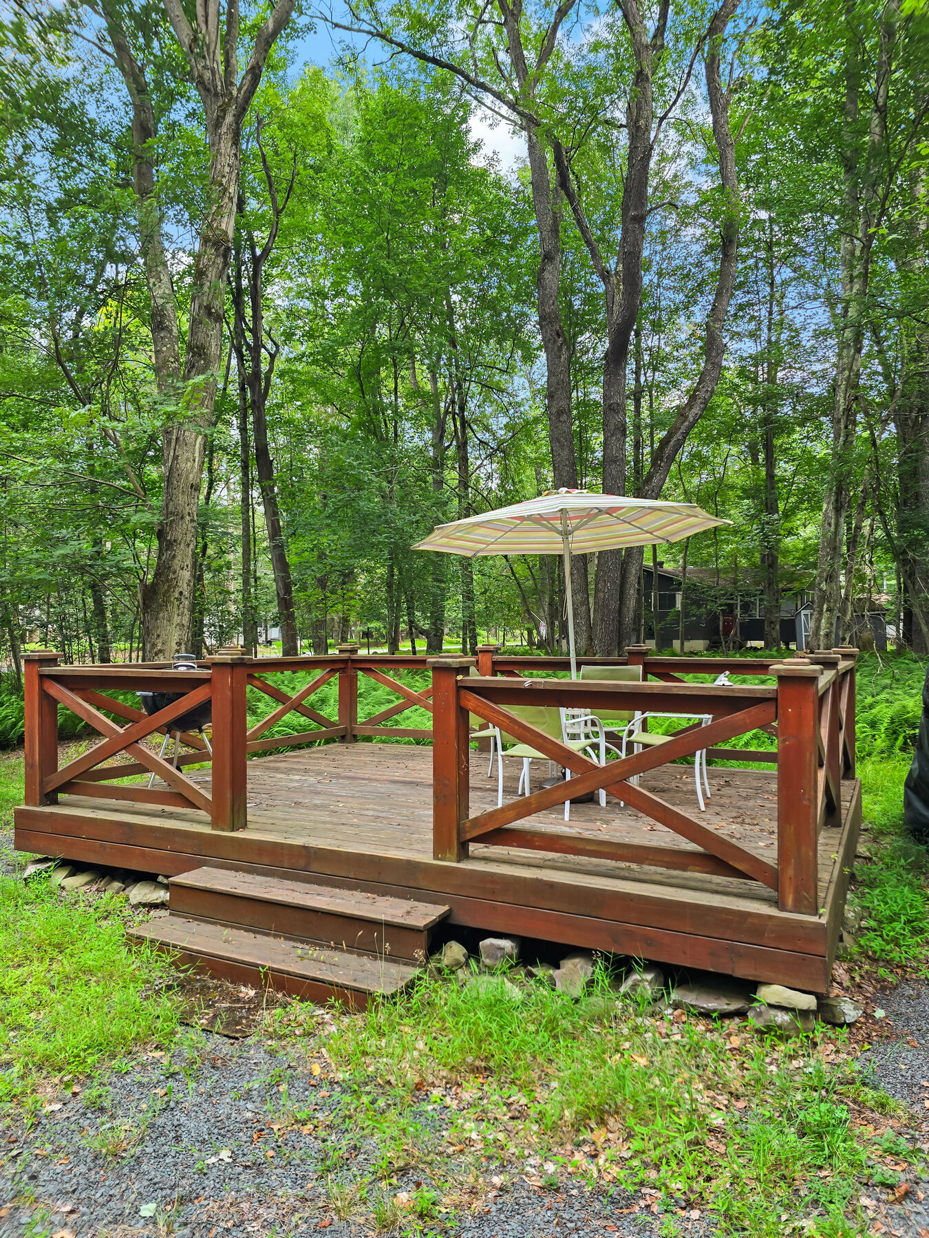 Deck with umbrella and dining table