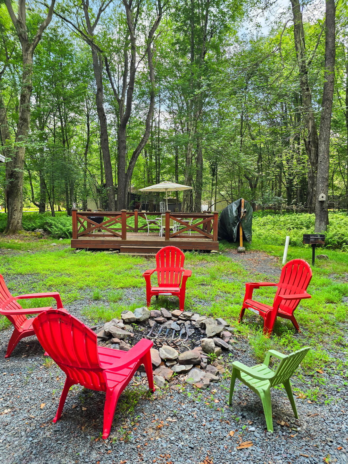 Outdoor fire pit with Adirondack chairs